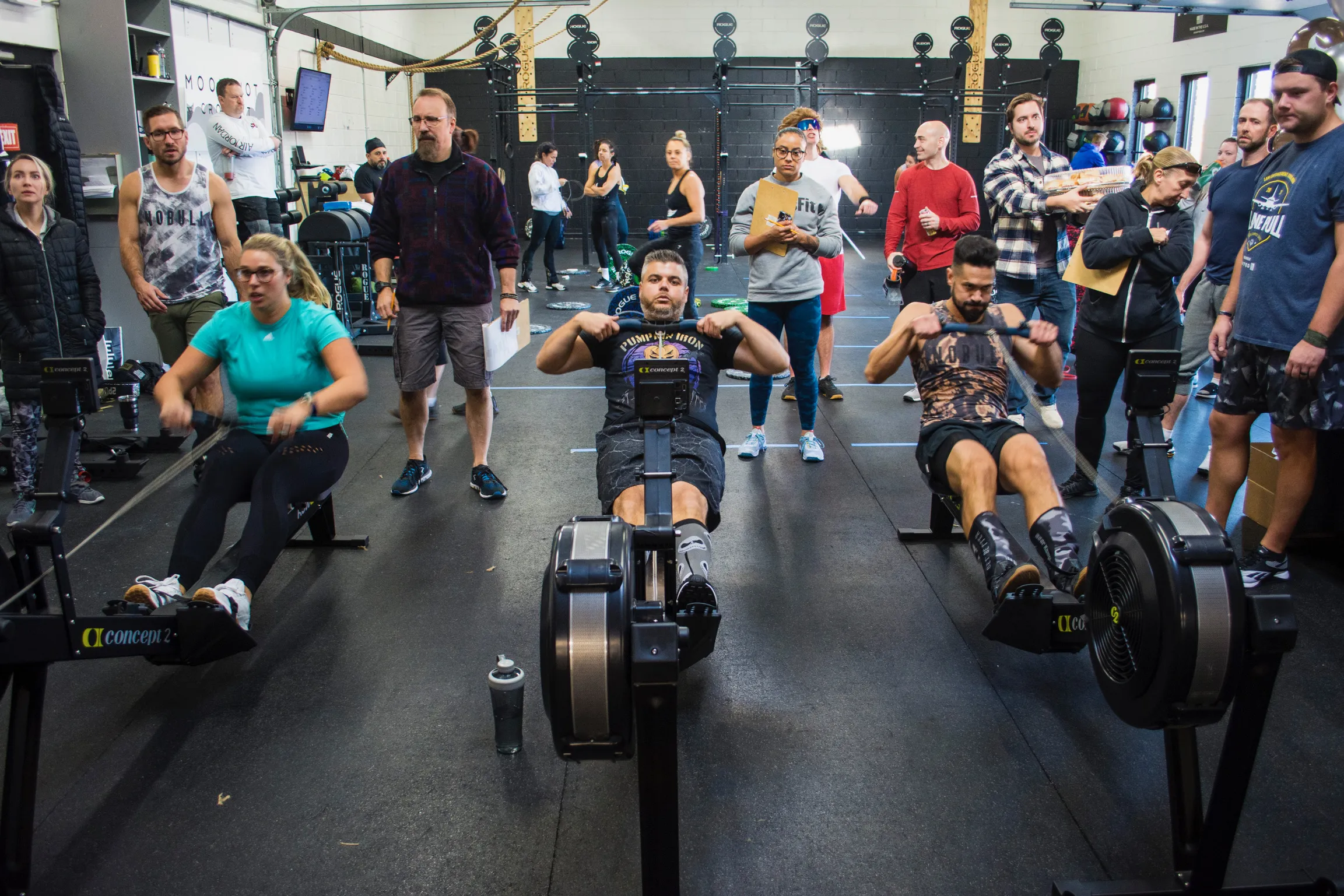 Members rowing together during a conditioning workout at Moonshot CrossFit