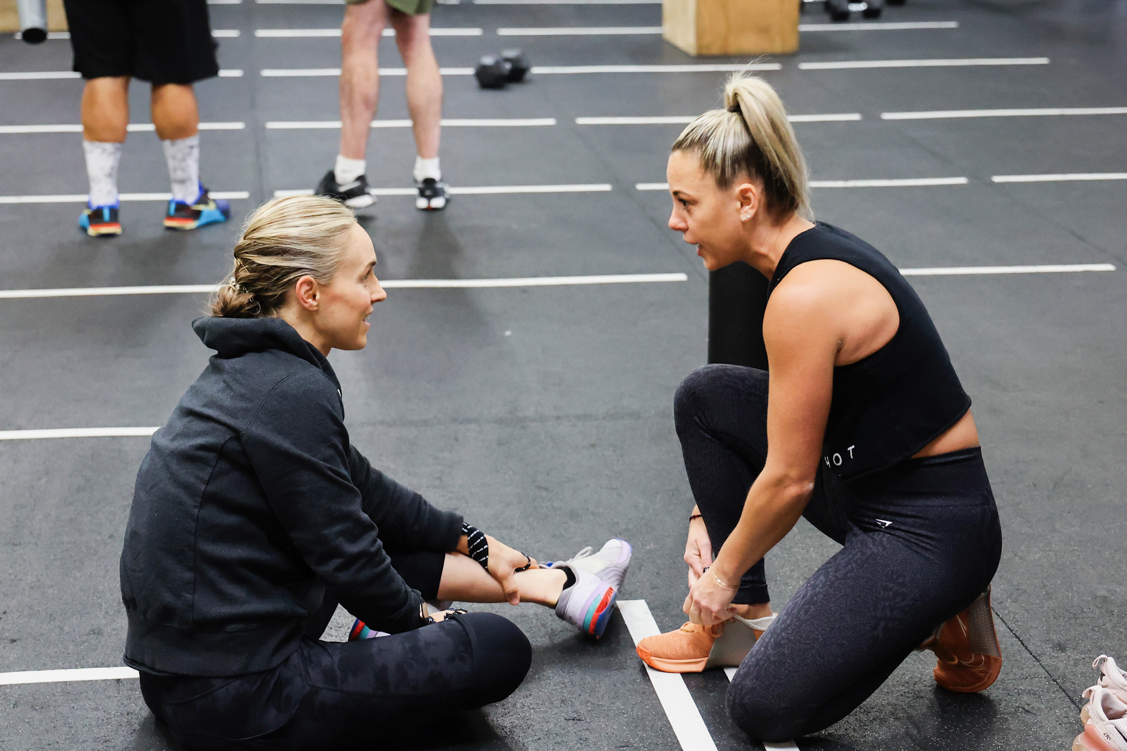 Friendly coach and member smiling at Moonshot CrossFit