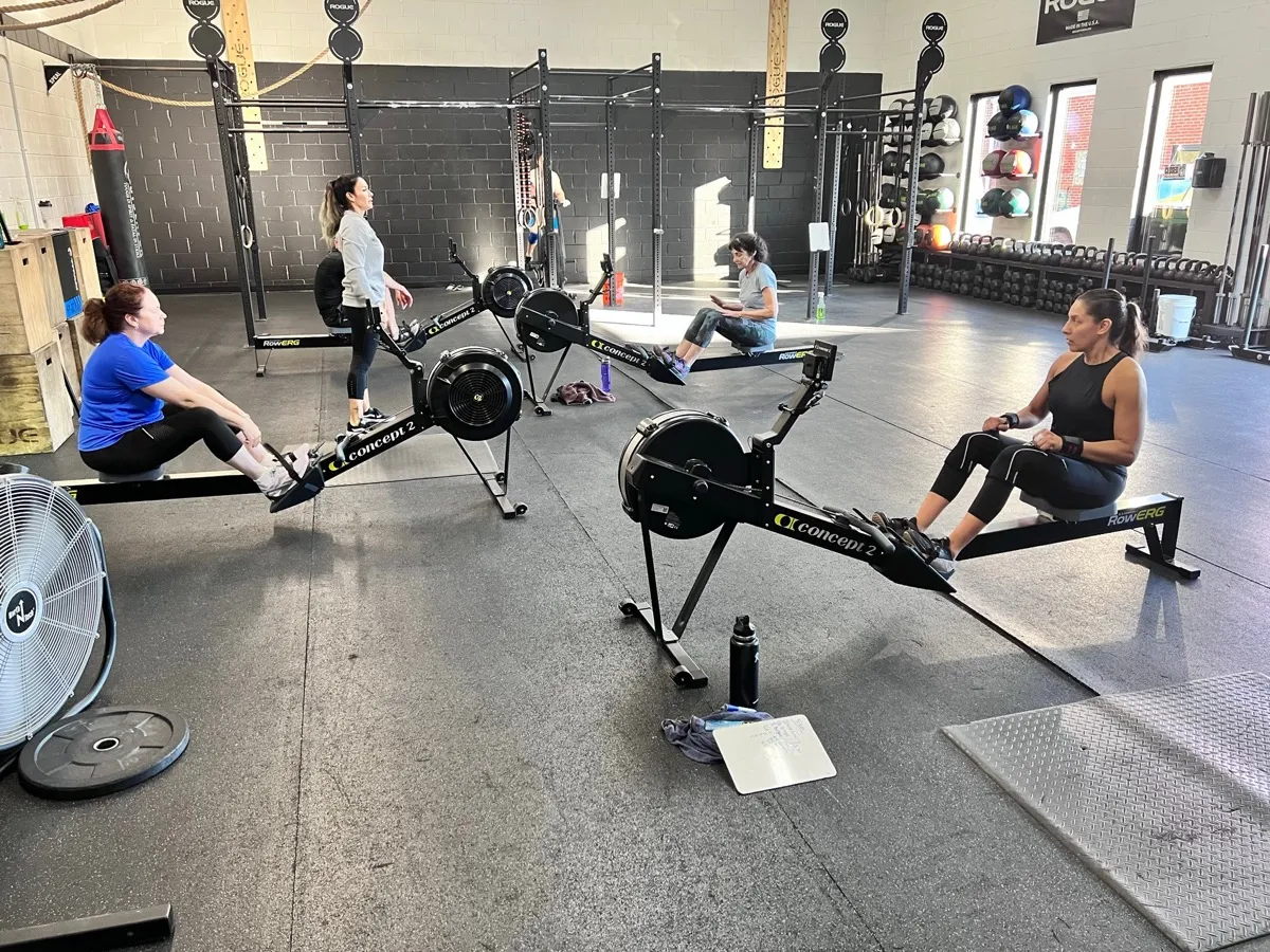 Members rowing during a class at Moonshot CrossFit