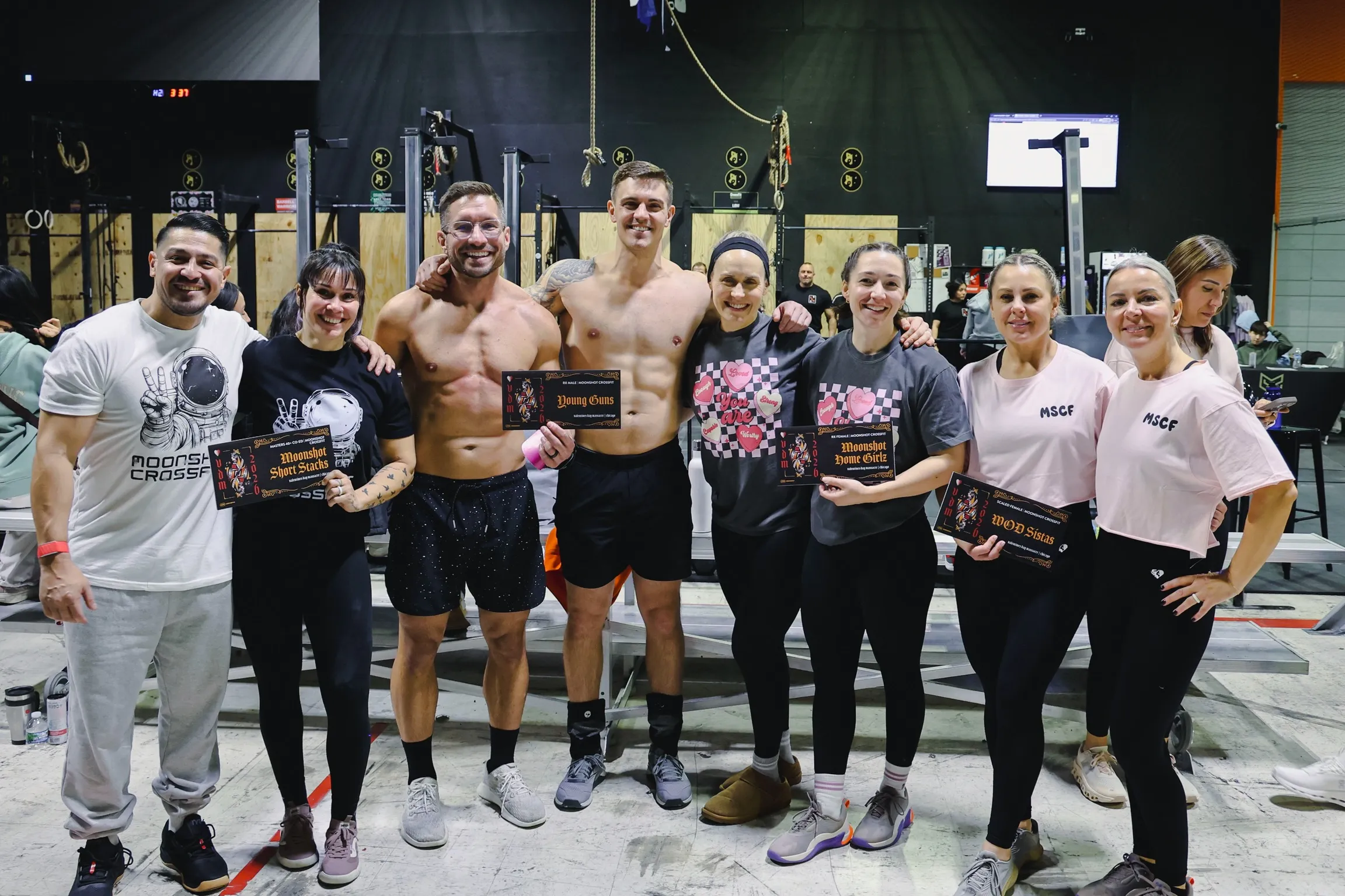 Moonshot CrossFit competition teams celebrating with awards at a local fitness event