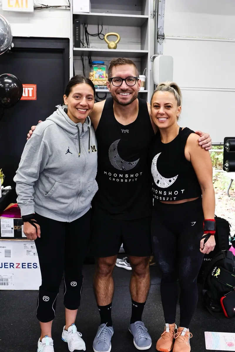 Moonshot CrossFit members welcoming each other at the gym