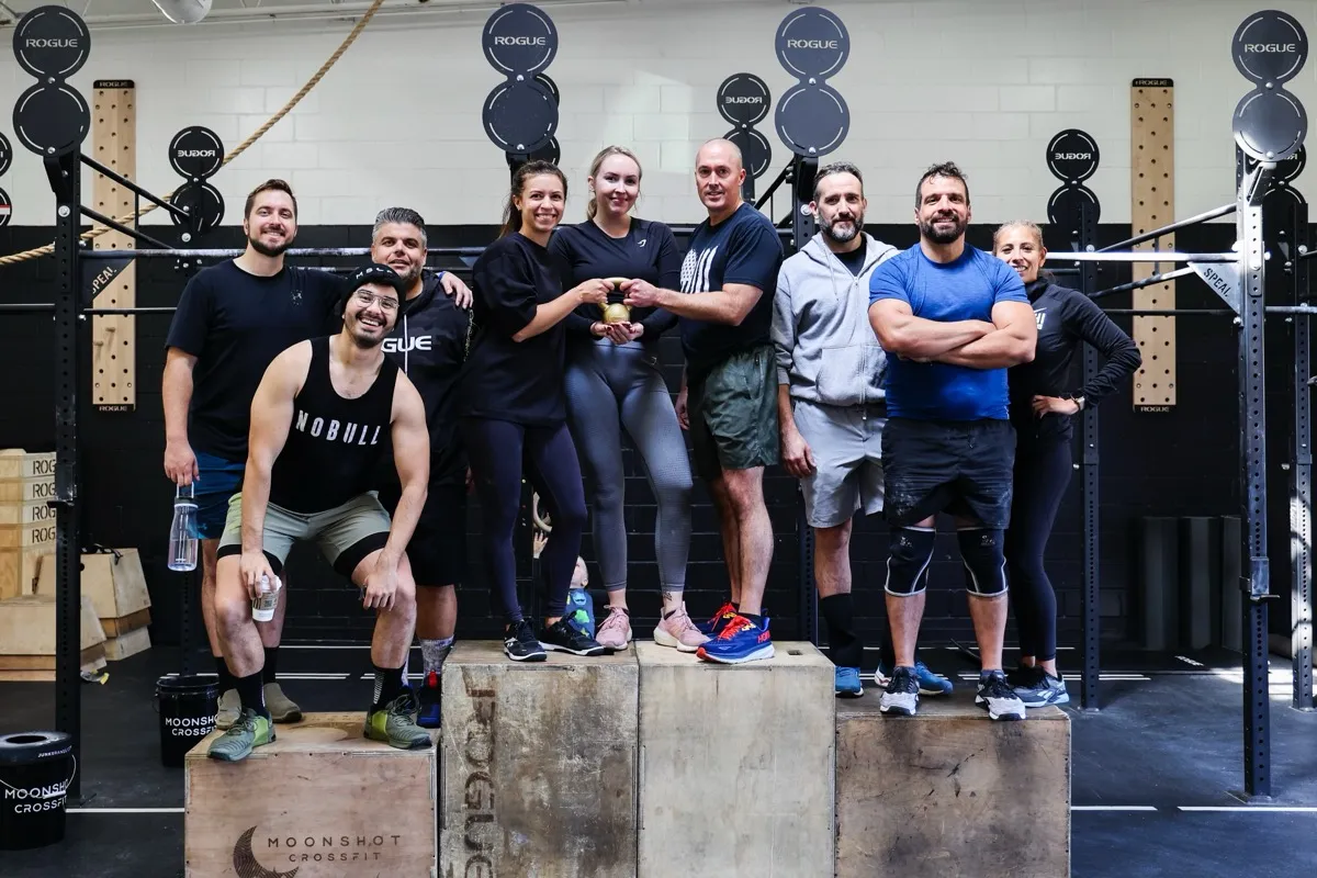 Moonshot CrossFit members posing together at the gym after a workout