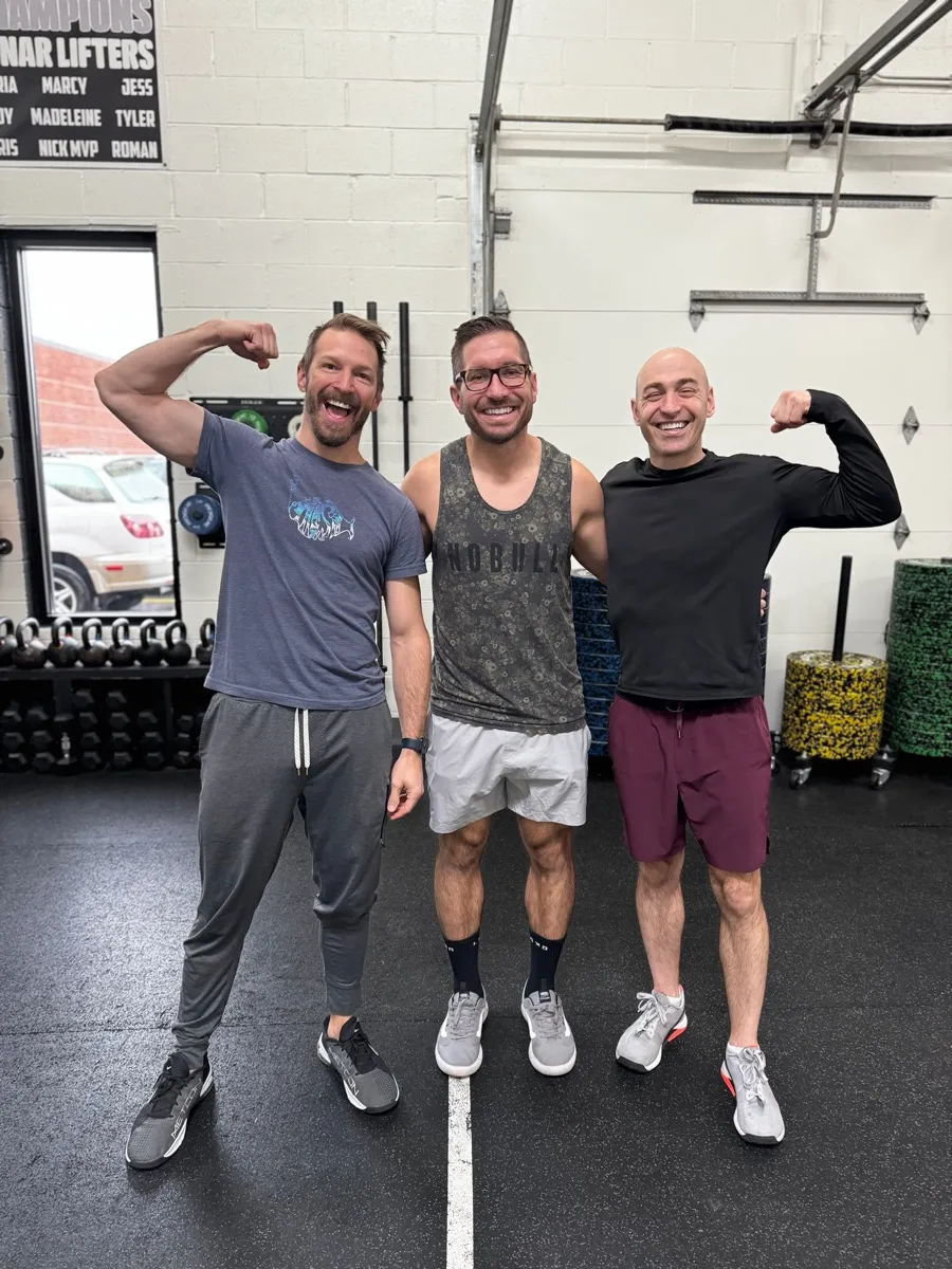 Moonshot CrossFit members flexing and having fun together at the gym