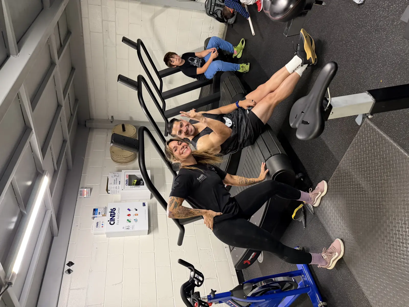 Two Moonshot CrossFit members smiling together at the gym after a workout