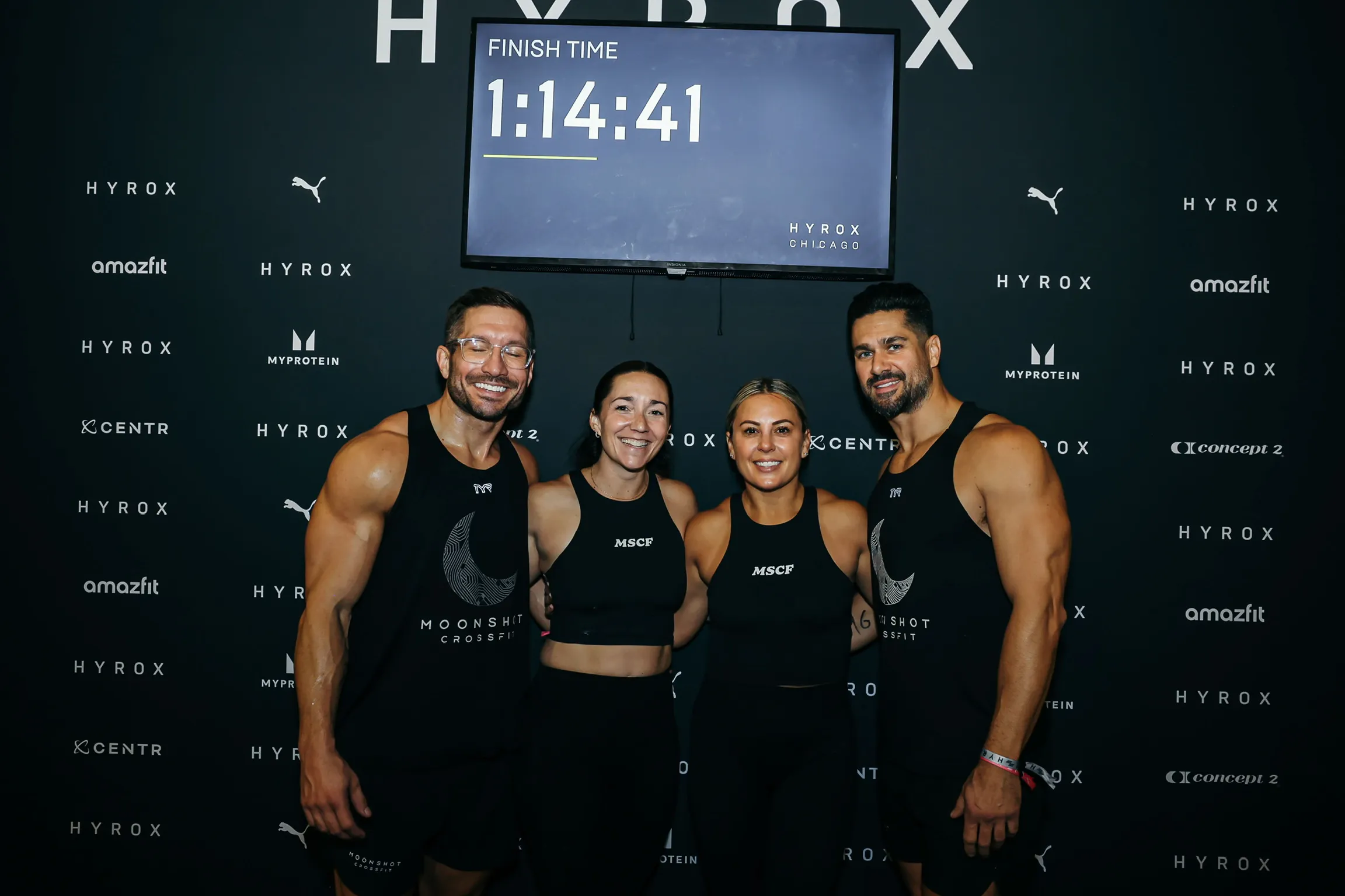 Moonshot CrossFit team posing at HYROX Chicago with a 1:14:41 finish time