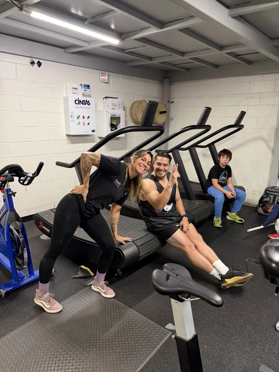 Two Moonshot CrossFit members smiling and having fun together at the gym