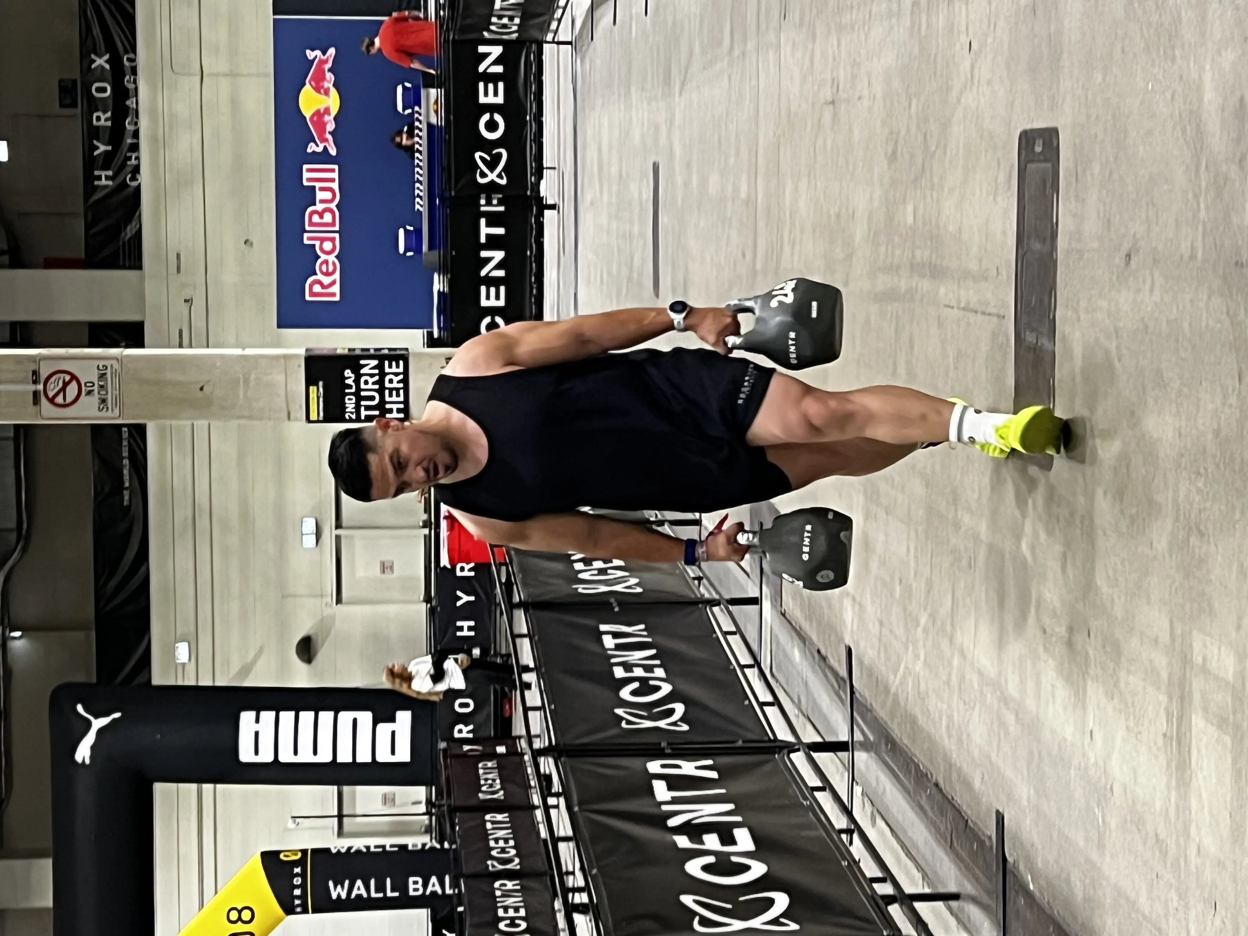 Athlete doing farmers carry at Hyrox competition