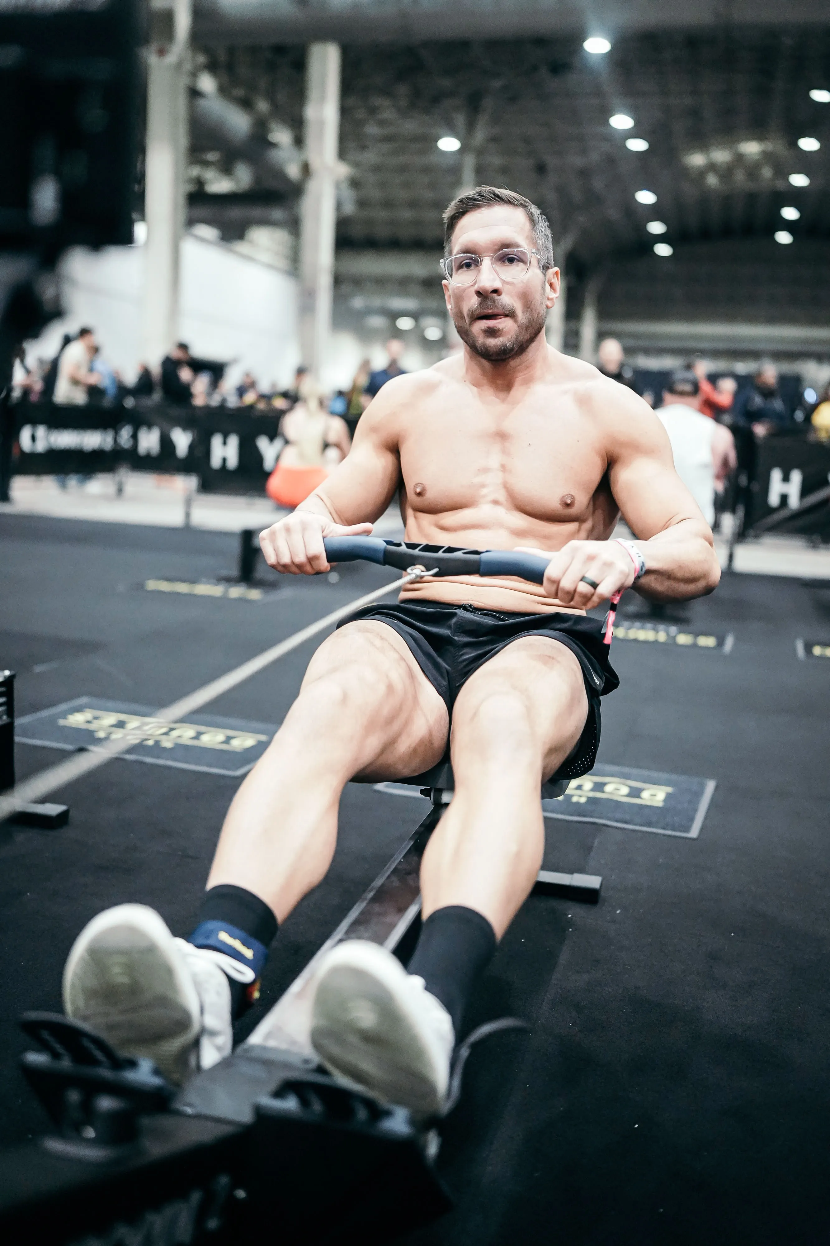 Athlete rowing during Hyrox competition