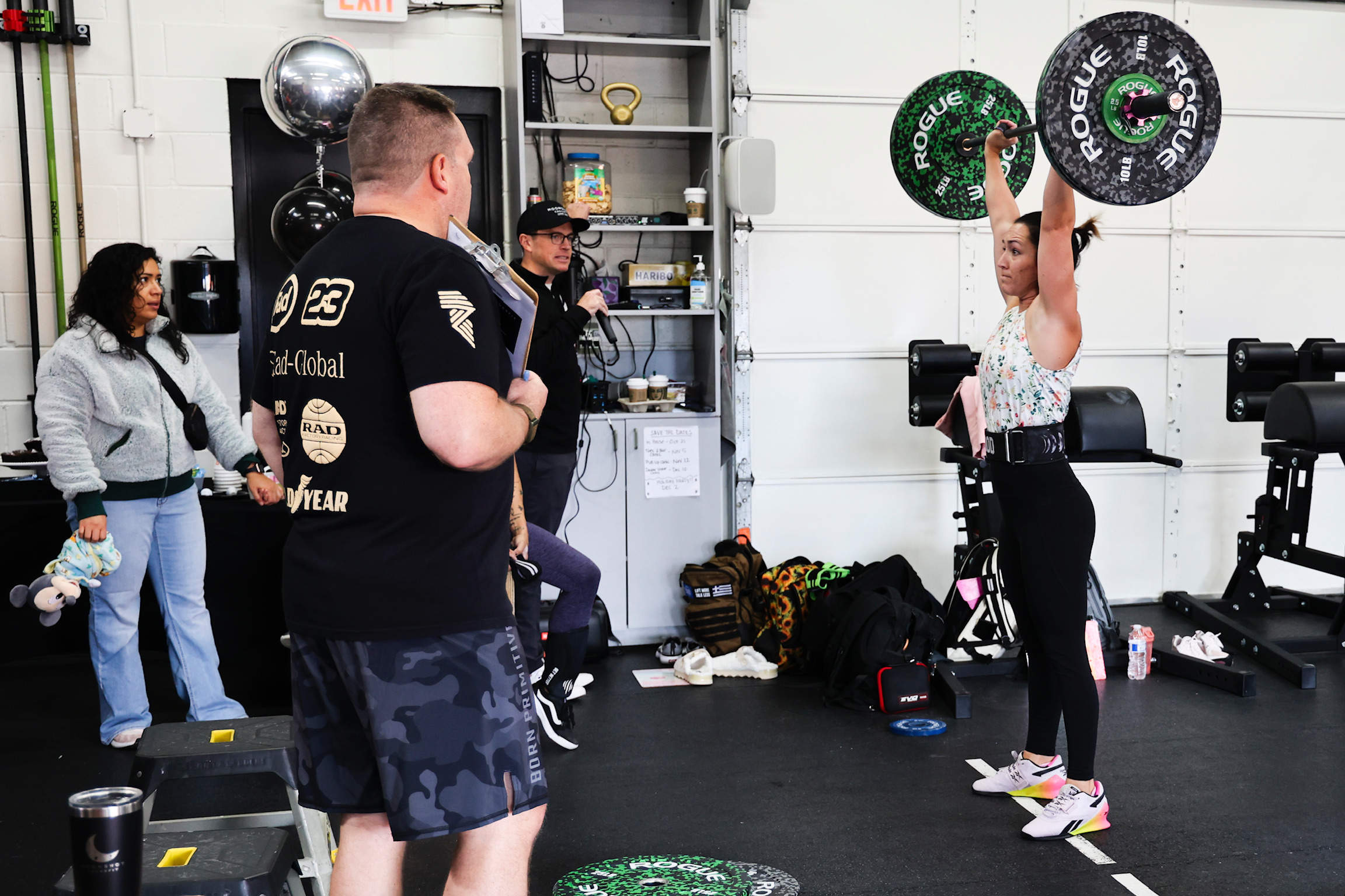 Member performing a dumbbell press